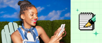 A woman sitting on a lawn chair smiling and looking at her phone