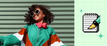 Woman smiling and dancing in front of a wall