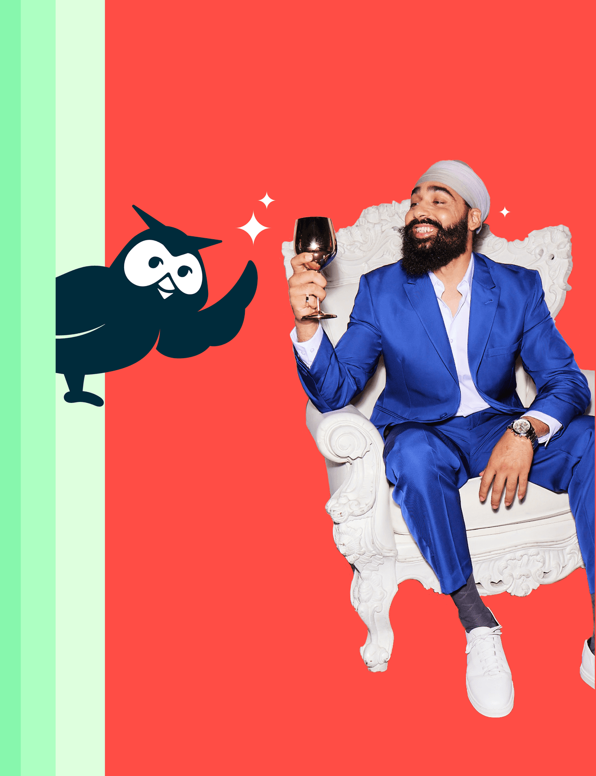 Man sitting in a chair, smiling and holding a glass with Owly