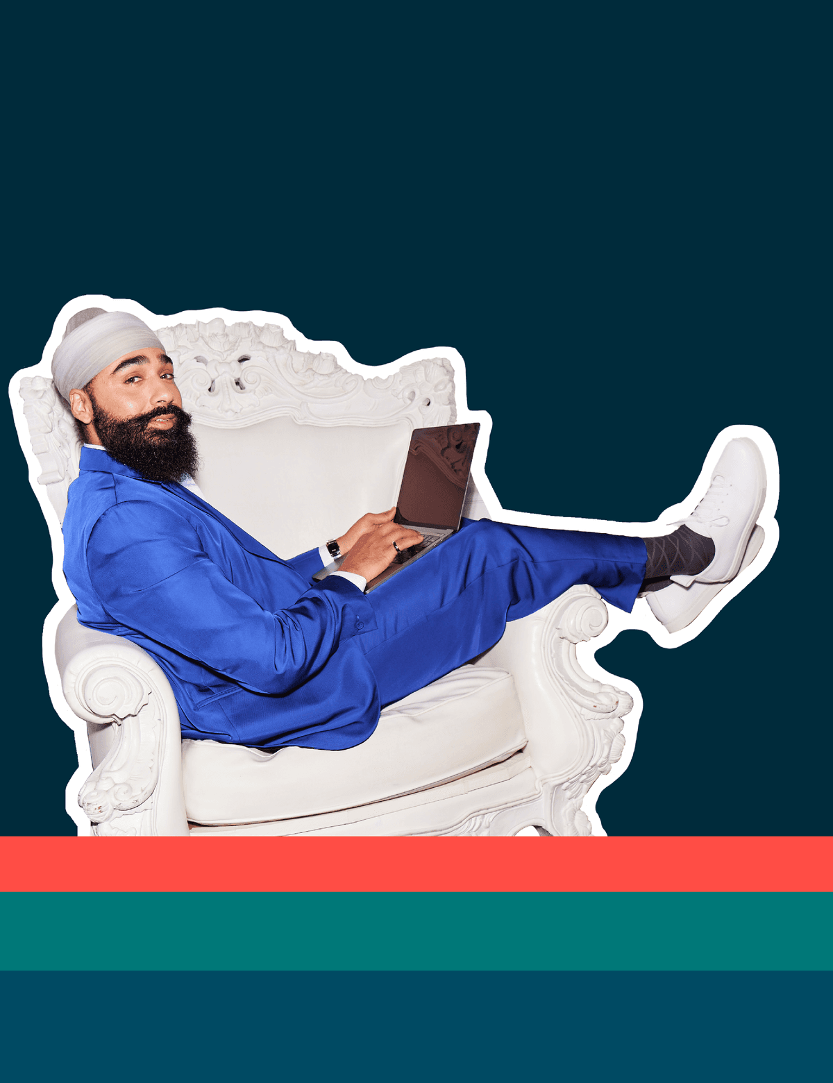 Man sitting in a chair and posing with his laptop